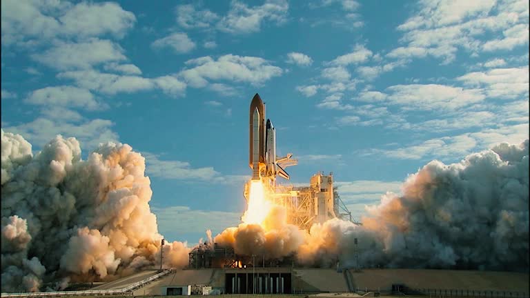 Space Shuttle lifts off from the launch pad. Shuttle lifting off.