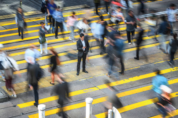 istock Blurred Businesspeople On Their Way To Work 1386631527