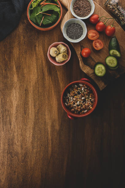 istock healthy cooking preparation on wooden rustic kitchen table background with cutting board 1386636896