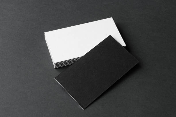istock Business card on black background. 1386640986