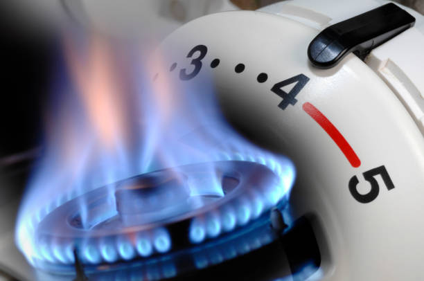 Rising energy costs with gas price and heating stock photo