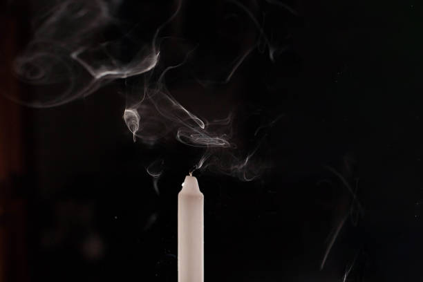 istock Burning candle over black. Is not isolated, just shot on black 1386645443