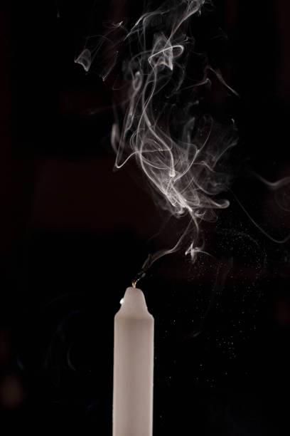istock Burning candle over black. Is not isolated, just shot on black 1386645457