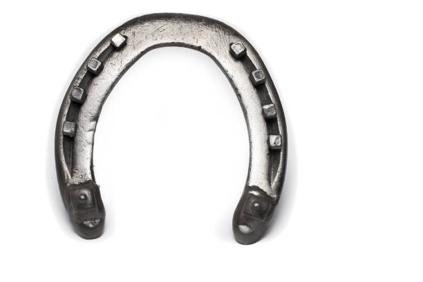 Close-up of horseshoes hanging outside the stable