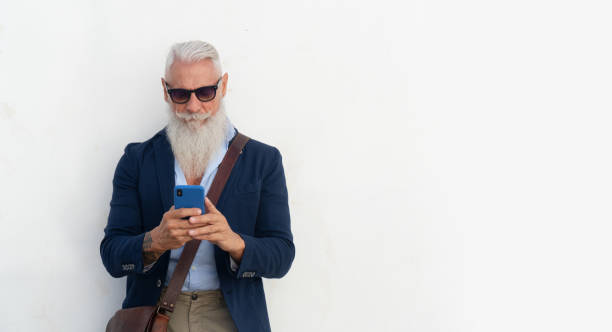 istock Senior man with a phone 1386648876