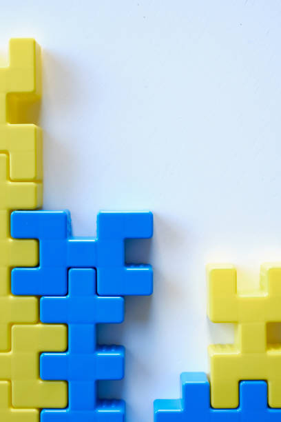 istock Colored puzzles on a light background. Logic games constructor for children and adults. Bright background and texture 1386659289