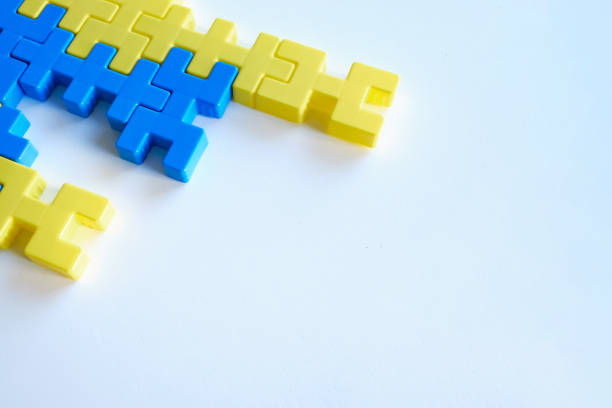 istock Colored puzzles on a light background. Logic games constructor for children and adults. Bright background and texture 1386659291