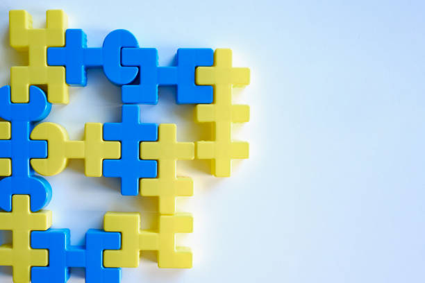 istock Yellow-blue puzzles on a light background. Logic games constructor for children and adults. Bright background and texture. Ukrainian flag. Ukraine love concept 1386659298