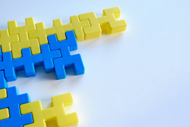 istock Yellow-blue puzzles on a light background. Logic games constructor for children and adults. Bright background and texture. Ukrainian flag. Ukraine love concept 1386659299