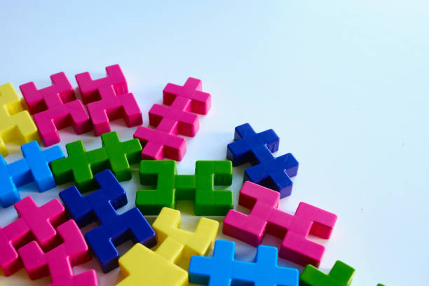 istock Colored puzzles on a light background. Logic games constructor for children and adults. Bright background and texture 1386659301