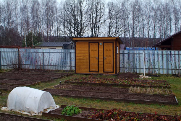 istock plants covered with cloth before winter in the garden 1386665840