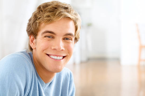 Shot of a young man relaxing at home You'll never be happier than in your own skin only young men stock pictures, royalty-free photos & images