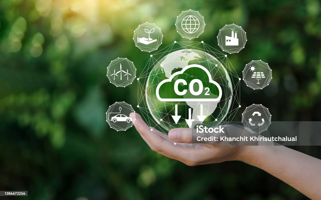 Reduce CO2 emission concept in the hand for environmental, global warming, Sustainable development and green business based on renewable energy. Low-carbon Economy Stock Photo