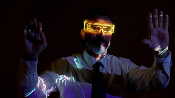 istock Mature businessman with augmanted reality glasses 1386672330