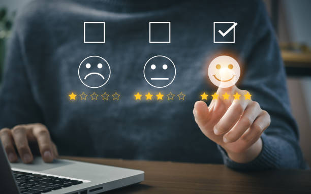 istock User give rating to service experience on online application for Customer review satisfaction feedback survey concept. 1386672372
