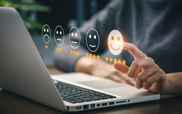 istock User give rating to service experience on online application for Customer review satisfaction feedback survey concept. 1386672382