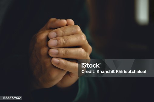 istock Man worship pray for god blessing to wishing have a better life. Man hands holding praying to god with the bible. christian life crisis prayer to god concept 1386672432