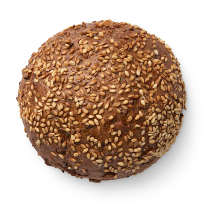 Round rye bun with sesame seeds, isolated on white background