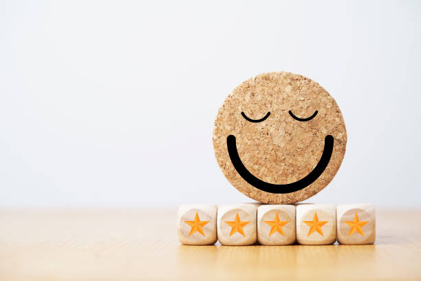 istock circle smile face with five stars for customer client evaluation after use product and service concept. 1386682243