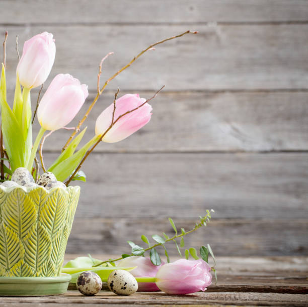 istock easter composition with eggs and flowers on wooden background 1386682475