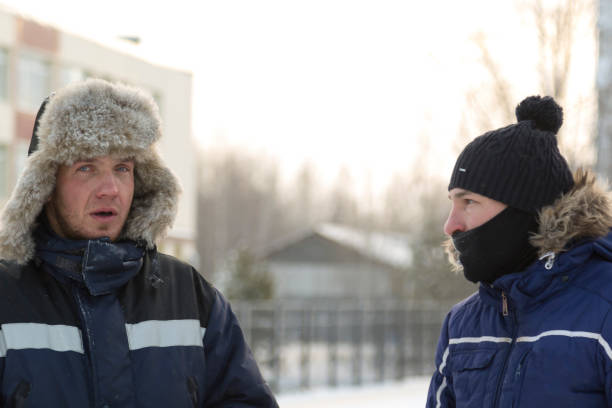 Two workers at the site of the ice camp