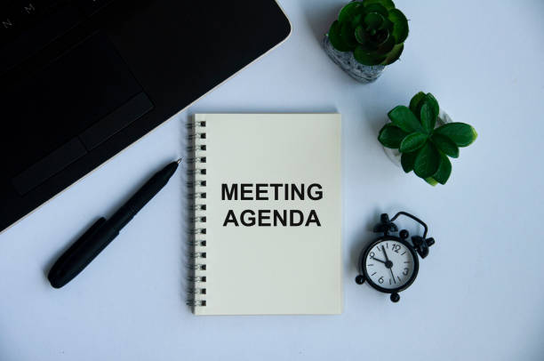 istock Meeting agenda text on notepad with office concept background. Business concept 1386693122
