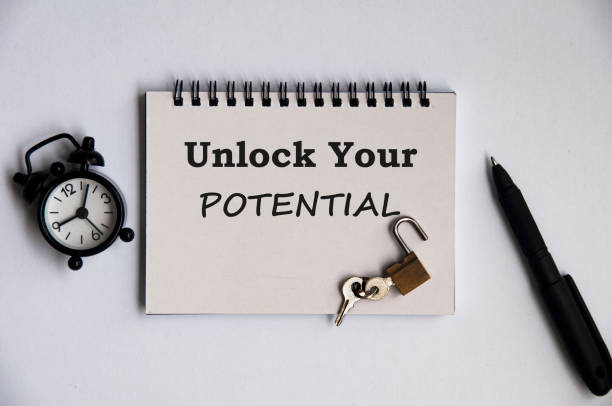 istock Motivational quote notepad - Unlock your potential. Motivational concept 1386693259