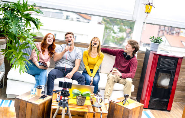 istock Trendy friends startupper having fun on streaming platform - Content marketing concept with millenial guys and girls sharing live vlog feed on social media - Bright vivid filter on tilted composition 1386693605