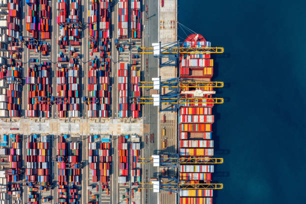 istock Aerial view of cargo ship and cargo container in harbor. 1386695012