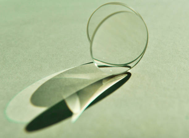 Two convex lens scattering and refracting beam of natural light.