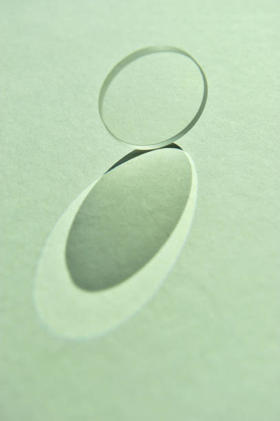 Convex lens refracting and scattering natural light.