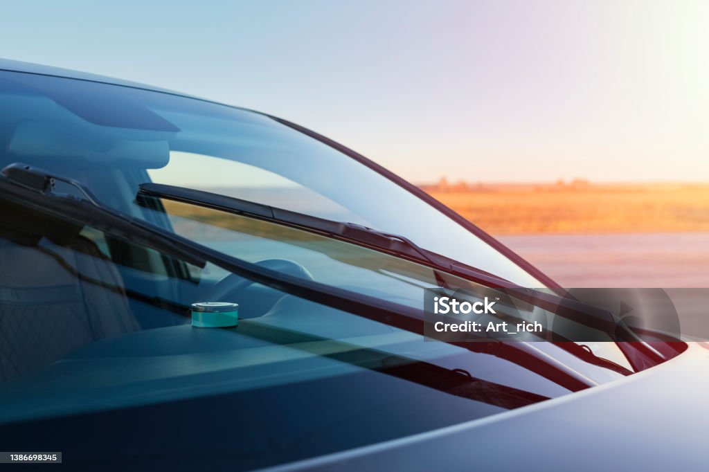 Car windshield brushes. The concept of cleaning products, glass polishing Car windshield brushes. The concept of cleaning products, glass polishing, rain protection. copy space Car Stock Photo