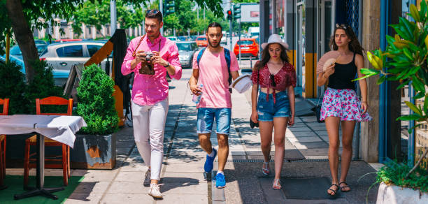 istock Four tourist's (explorers) taking a walk at a Mediterranean city. 1386702276