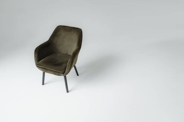 istock Stylish modern design armchair on gray background. Minimal concept 1386703369