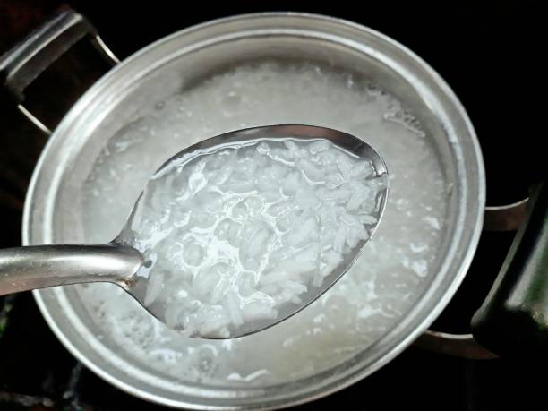 istock Cooking Rice Porridge - food preparation. 1386705304