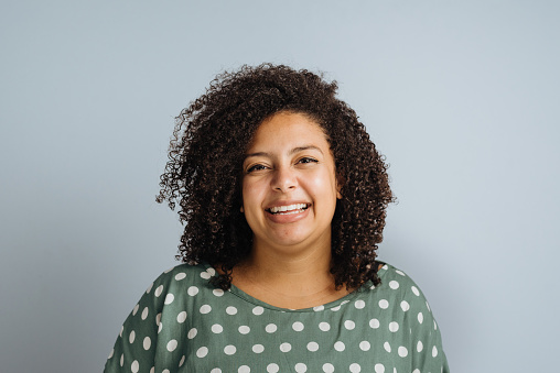 Smiling curly plus size woman