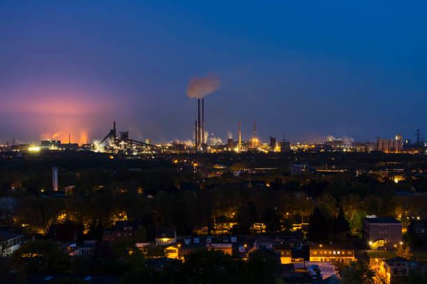 istock Glowing Steel Plant At Night 1386706267