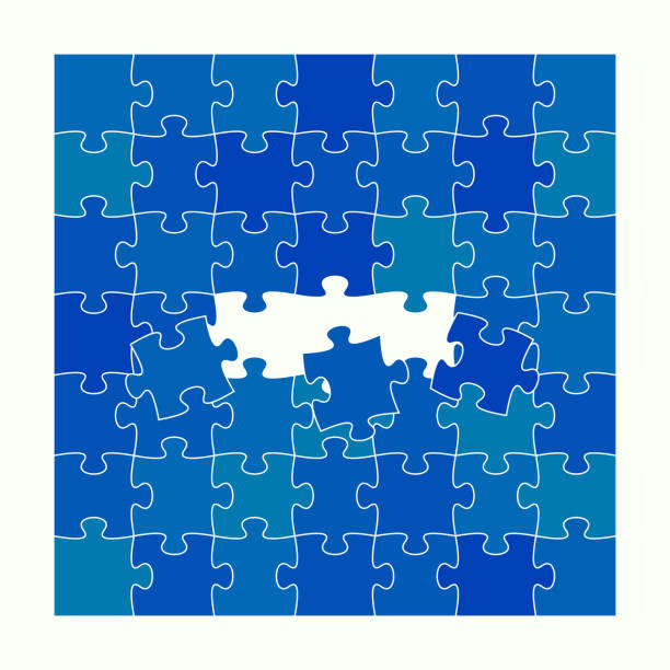 istock Finishing last three pieces of jigsaw puzzle 1386706274