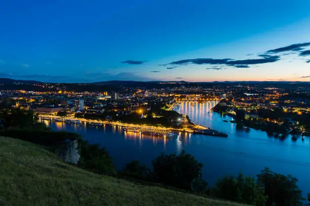 View of Deutsches Eck and the oldtown of Koblenz, Germany with  Rhine and Moselle River in the night.
