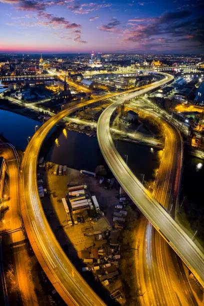 Aerial view of the Odra River, city highway and the city of Szczecin by night, Poland