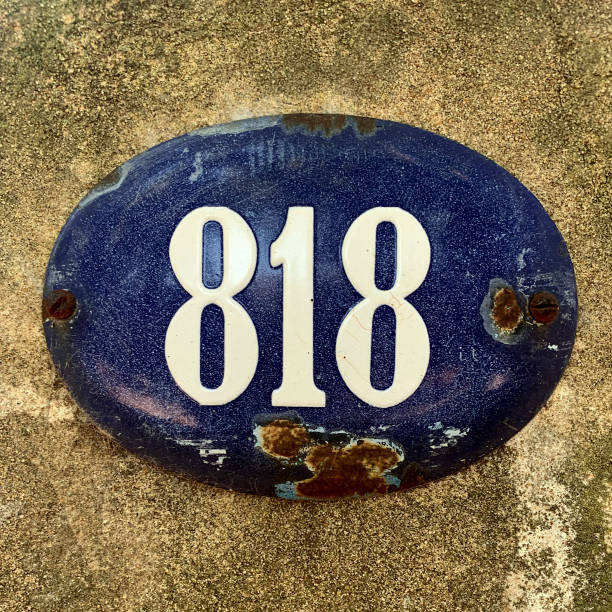 istock Old house number on the wall 1386708922