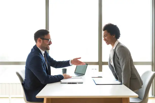 Photo of Business, job interview, career or negotiations concept, two employees on the meeting