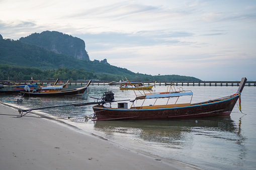 Group of passenger longtail boat at evening koh mook sea in trang and krabi south thailand asia
