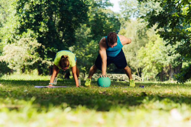fitness, sport, martial arts, self-defense and healthy lifestyle concept - group of teenage friends or sportsmen exercising and at boot camp