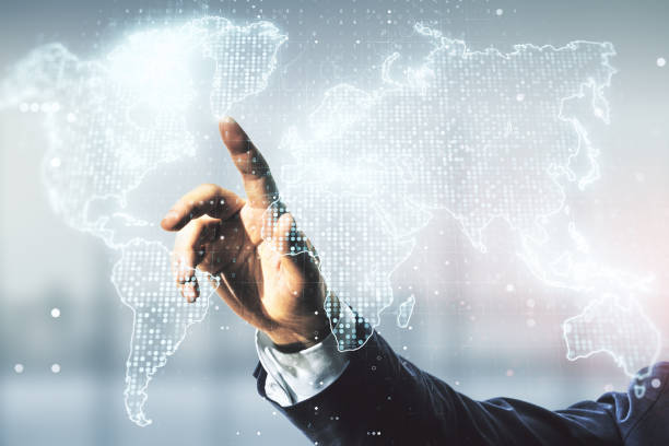 istock Multi exposure of man hand working with abstract graphic world map on blurred office background, connection and communication concept 1386710646
