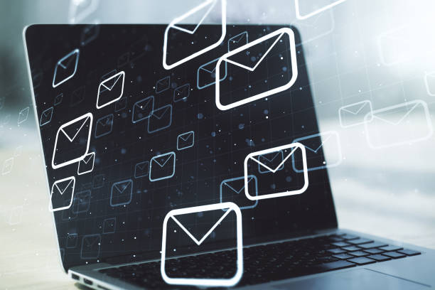 istock Creative concept of postal envelopes illustration on modern laptop background. Email and communications concept. Multiexposure 1386710651