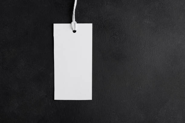 istock Blank paper rectangular price tag mockup isolated on black background, Sale and black friday concept 1386712089