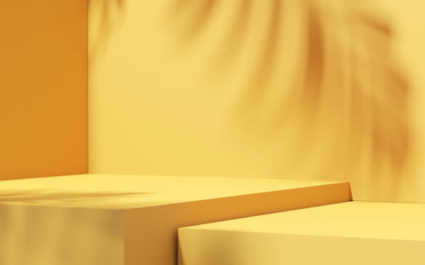 istock Minimal abstract yellow background for product presentation. Tropical leaf shadow on plaster wall. Spring and summer. 1386712801