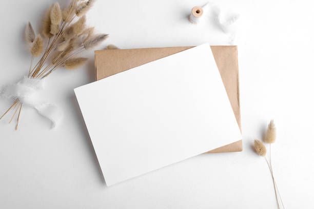 istock Wedding stationery invitation card mockup 7x5 on white background with envelop and boho decor 1386712905