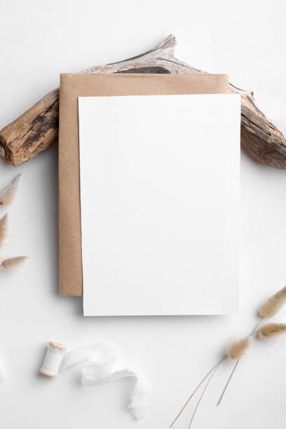 istock Wedding stationery invitation card mockup 5x7 on white background with envelop and boho decor, vertical card 1386712907